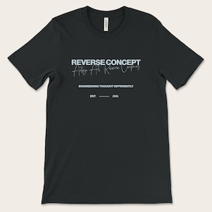 May include: Black t-shirt featuring the text "REVERSE CONCEPT" in light blue, with the tagline "Art is Art Reverse Company" in a script font. The shirt also displays "ENGINEERING THOUGHT DIFFERENTLY" and "EST. 2026".
