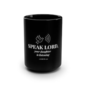May include: A black ceramic mug featuring a white line art graphic of a dove with sound waves above the text that reads: SPEAK LORD, your daughter is listening, 1 SAMUEL 3:9. The mug has a smooth, glossy finish and a cylindrical shape.