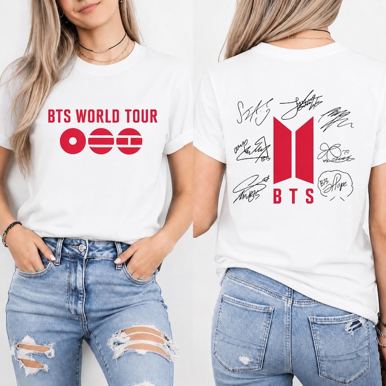 May include: White t-shirt featuring the text "BTS WORLD TOUR" in red on the front. The back of the shirt displays the BTS logo in red, along with signatures and the word "BTS".