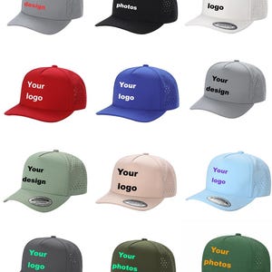 May include: A collection of twelve baseball caps in various colors including gray, black, white, red, blue, green, pink, and light blue. Each cap features a perforated mesh back panel, a solid front panel, and customizable text.