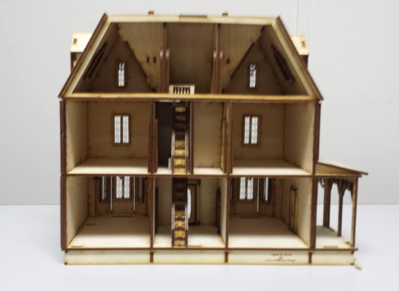 May include: A wooden dollhouse with four levels, showing the interior of each room. The dollhouse has a staircase, windows, and a porch.