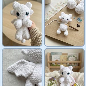 May include: A collection of handmade white crochet dragon toys with blue eyes. The toys have small wings and are displayed in various settings, including a wooden surface with yarn and a shelf with books.