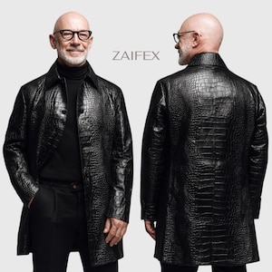 May include: A black long-sleeved coat with a textured crocodile skin pattern, featuring a pointed collar and a button-down front. The garment is displayed from both front and back angles, with the brand name ZAIFEX printed in the center.