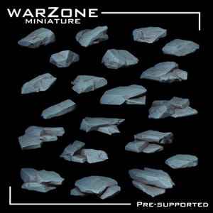May include: A collection of twenty individual light gray rock miniatures arranged in a grid. Each piece features jagged, angular surfaces and realistic stone textures. The text WARZONE MINIATURE and PRE-SUPPORTED is visible in white.