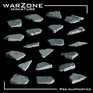 May include: A collection of nineteen grey, flat, irregular stone-like miniature bases with cracked textures. The text WARZONE MINIATURE is at the top, and PRE-SUPPORTED is at the bottom. These pieces are designed for tabletop gaming figures.