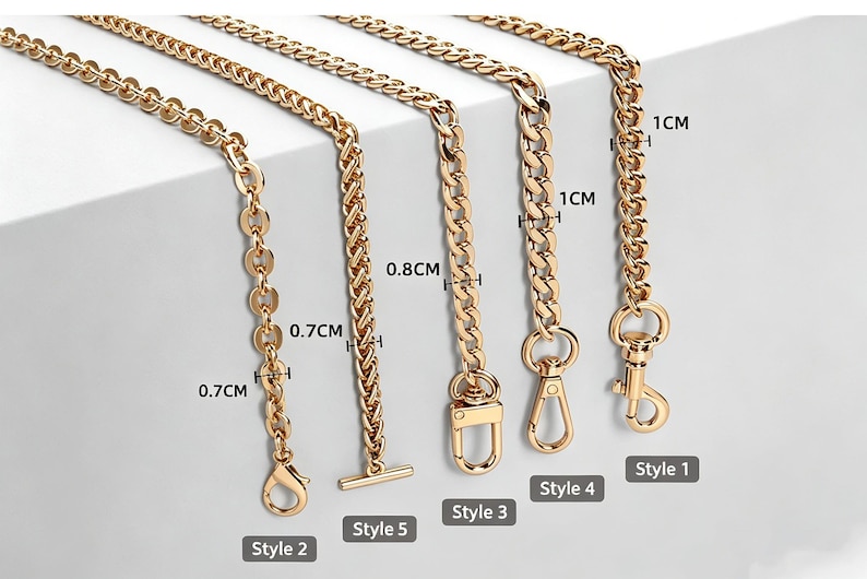 May include: Five gold-toned metal chains of varying link designs and widths, labeled Style 1 through Style 5. The chains feature lobster claw clasps or a T-bar toggle, with visible width measurements of 0.7cm, 0.8cm, and 1cm printed on the image.