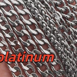 May include: A collection of silver-toned metal chains featuring various link sizes and styles, including thick curb links and thinner, more intricate chain designs. The word platinum is displayed in orange text across the lower left section.