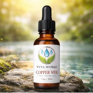 May include: An amber glass dropper bottle with a black cap and a white label. The label features a green leaf and blue water drop logo, the text VYTA.WORLD, COPPER VEIL, Copper Peptide Serum, and the volume measurement of 1 oz / 30ml.