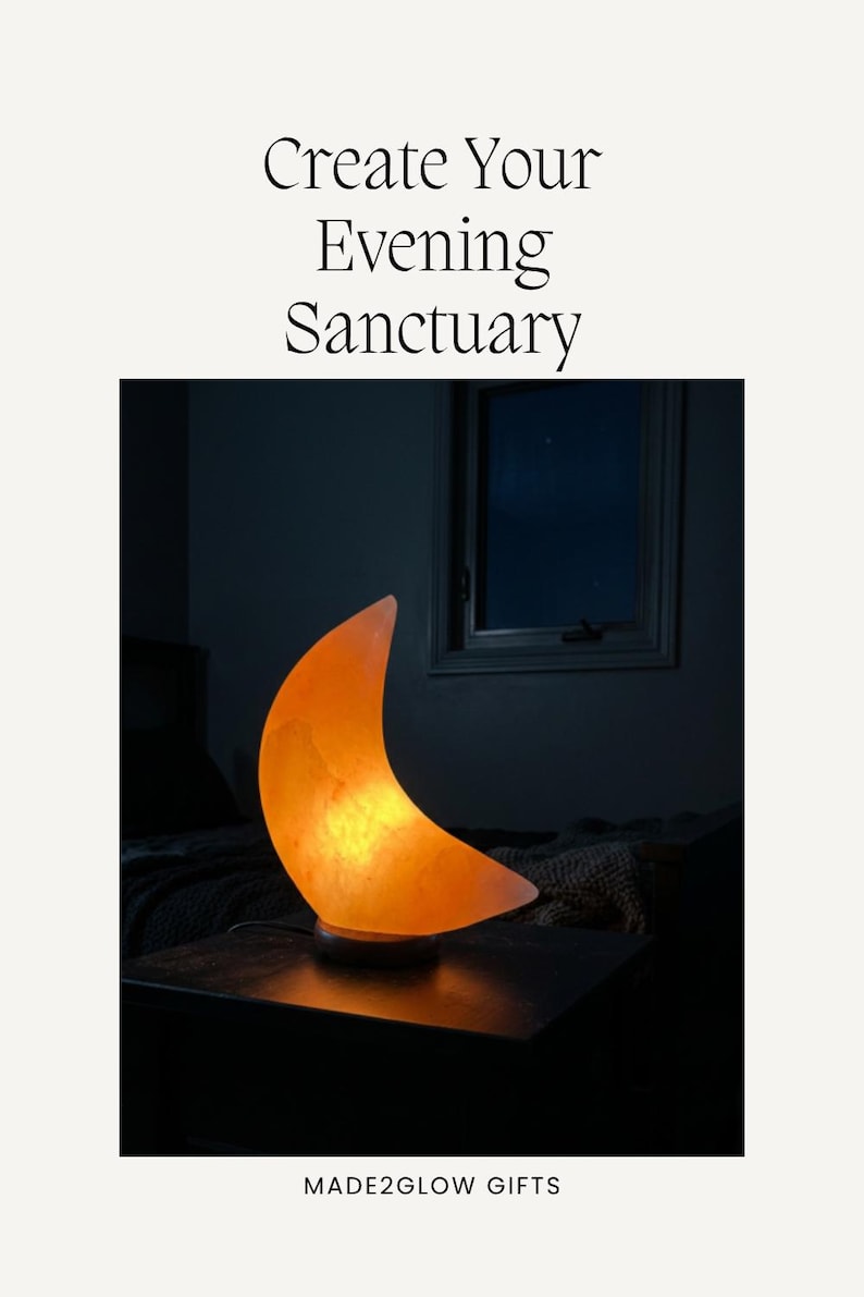 May include: A crescent moon-shaped salt lamp emitting a warm orange glow, resting on a dark circular base. The text 'Create Your Evening Sanctuary' appears above the lamp, and 'MADE2GLOW GIFTS' is printed at the bottom of the image.