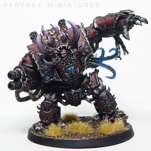 May include: A detailed miniature figure of a monstrous creature with a dark red and purple color scheme. The figure has multiple horns, a large weapon, and blue tentacles. The base is brown with patches of dry grass. The text "FANTASY MINIATURES" is at the top.