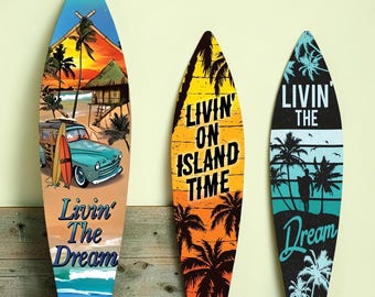 May include: Three decorative surfboards with tropical beach scenes. One board features a teal car, a beach hut, and the text "Livin' The Dream." Another says "Livin' On Island Time" with palm trees. The third board has a silhouette and the words "Livin' The Dream."