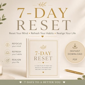 May include: A book titled "7-DAY RESET" with gold lettering and a gold pen on a white surface. The image includes a vase with greenery, a lit candle, and text that reads "Reset Your Mind, Refresh Your Habits, Realign Your Life."