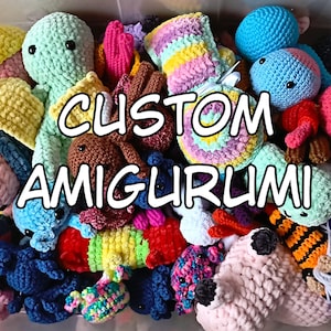 May include: A collection of various colorful crocheted amigurumi plush toys in different shapes and sizes, including animals and abstract forms, with the text CUSTOM AMIGURUMI overlaid in white letters across the center of the image.