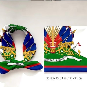 May include: A silk scarf and a square fabric featuring the Haitian flag design. The scarf is white with blue and red accents, and the text "UNION FAIT LA FORCE". The square fabric measures 35.83 x 35.83 inches.
