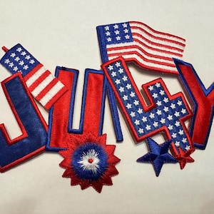 May include: Red, white, and blue felt patches spelling out "JULY" with a star and a firework design.