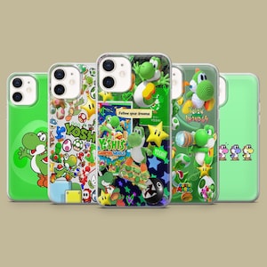 May include: A collection of five phone cases featuring various designs of the character Yoshi from the Super Mario video game series. The cases are primarily green, with images of Yoshi, stars, and text like "Yoshi's Crafted World" and "Follow your dreams."