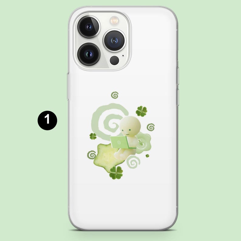 May include: White phone case with a green and white illustration. The design features a small, round figure using a laptop, surrounded by green clovers and swirls. The number "1" is in a black circle in the upper left corner.