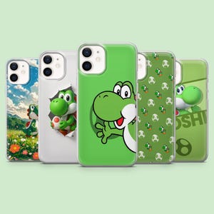 May include: A collection of five phone cases featuring the character Yoshi from the Super Mario franchise. The cases showcase various designs, including Yoshi in different poses, patterns, and a scenic background. The cases are in shades of green, white, and blue.