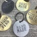 Custom handmade novelty keychains - hand stamped brass or aluminum - round key fob keychain
