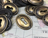 Vintage brass oval escutcheon -small keyhole - antique brass charm - keyhole pendant - key plate - vintage hardware - keyhole necklace