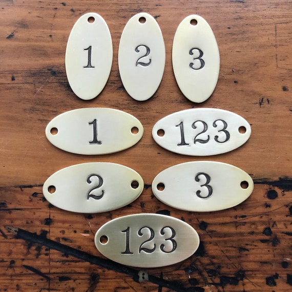 Hand punched brass Oval numbered tags -  Custom numbered locker tags - oval year date number plates - hotel room door numbers