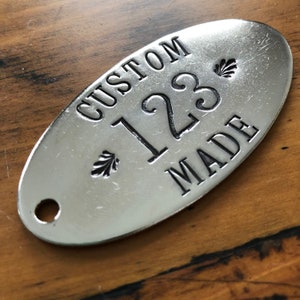 Custom hand punched oval Hotel Room Key Tags -  Nickel plated brass oval key chain fob - silver cow tag - bull ear tag -  numbers or letters