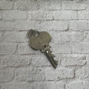 American tourister key  - Unique luggage or suitcase key - vintage key charm - old key