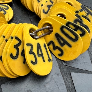 Vintage yellow plastic cow tag  -antique plastic livestock ID tag – plastic bull tag – cattle tag – industrial number -