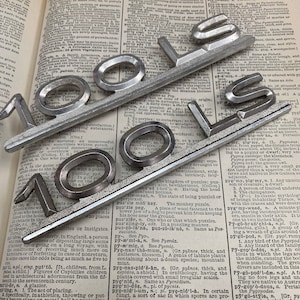 Vintage Audi 100LS ornament - metal sports car auto emblem - vintage metal classic car badge -