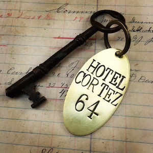 Custom hand stamped Hotel Room Key Tags -  brass key chain fob - brass cow tag - bull ear tag -  customized keychain tag - your name here