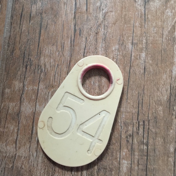Vintage plastic cow tag – White number 54  -antique plastic livestock ID tag – plastic bull tag – cattle tag – industrial number