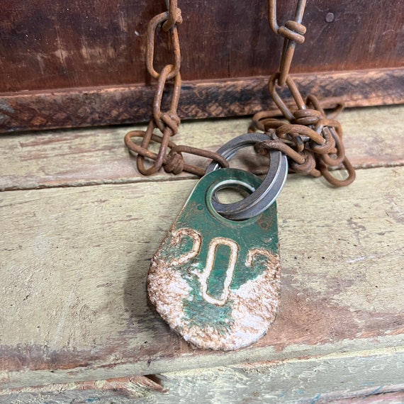 Vintage plastic cow tag on a chain – number 202  -antique plastic livestock ID tag – plastic bull tag – cattle tag – industrial number -