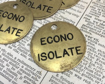 May include: Four brass tags with the words "ECONO ISOLATE" printed in black lettering. The tags are circular and have a hole at the top for hanging.