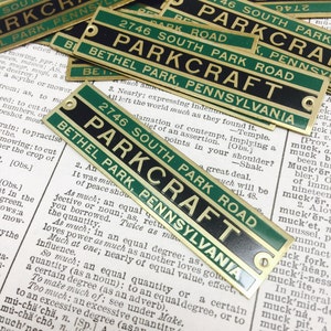 May include: A collection of vintage brass and green enamel street signs with the text "Parkcraft" and "Bethel Park, Pennsylvania".
