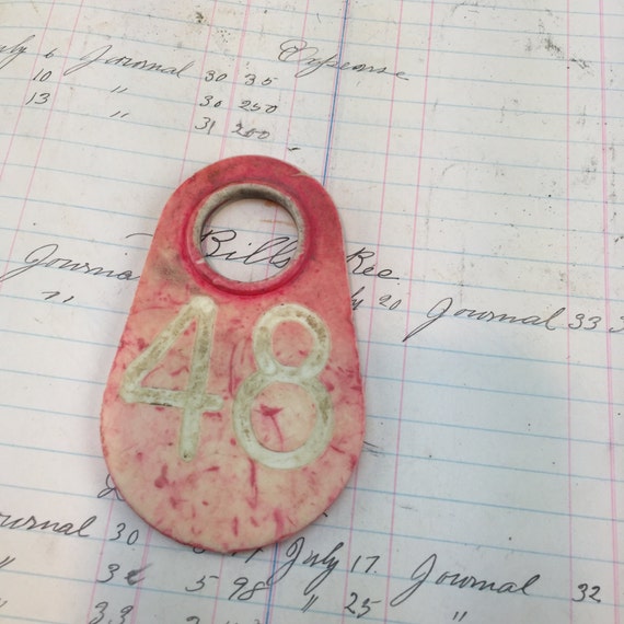 Vintage plastic cow tag – red number 48 -antique plastic livestock ID tag – plastic bull tag – cattle tag – industrial number - red bull