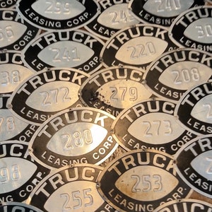 Metal pressed aluminum numbered truck plates - 4x6 plates - Truck Leasing Corp.