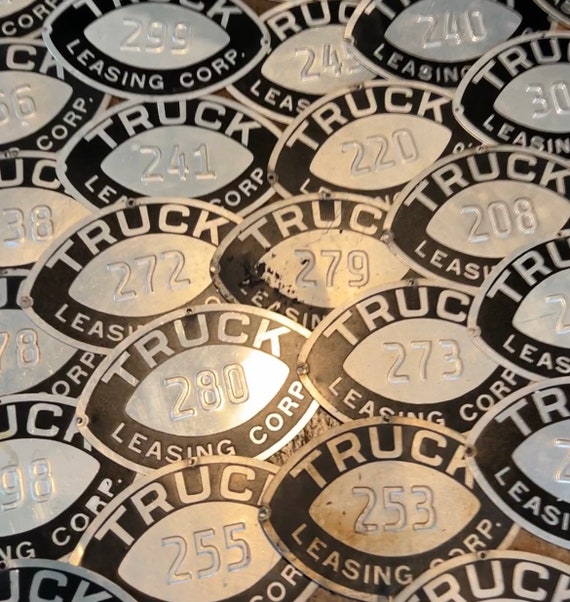 Metal pressed aluminum numbered truck plates - 4x6 plates - Truck Leasing Corp.