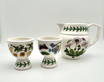 A Portmeirion creamer and two egg cups from the Botanic Garden collection.