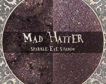 Sombra de ojos MAD HATTER: Morado sucio brillante con destellos cobrizos,