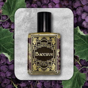 May include: A small glass bottle of perfume oil with a gold and black label. The label reads "Fabled Fragrances Bacchus Parfum Oil 0.5 fl oz (15 ml)".