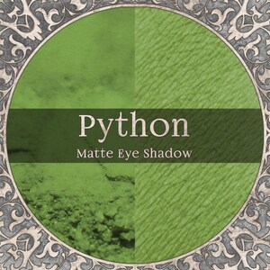 May include: A circular graphic featuring a green matte eye shadow labelled Python. The image displays a split view of the powder texture and a swatch on skin, framed by an ornate grey border. The text Python and Matte Eye Shadow are centred.