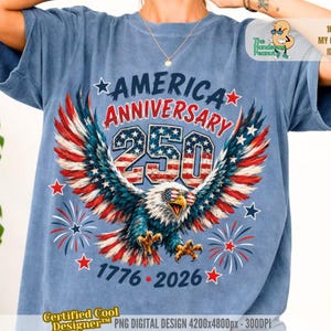 May include: A blue t-shirt featuring a graphic of a bald eagle wearing sunglasses with a red, white, and blue flag pattern. The text reads AMERICA ANNIVERSARY 250 and 1776-2026, surrounded by stars and firework illustrations in red, white, and blue colors.