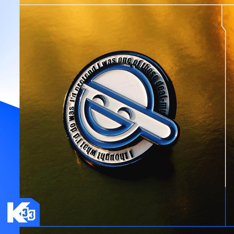 May include: A round enamel pin with a white and blue design. The pin features a stylized face and the text "I thought what I'd do was pretend I was one of those deaf-mute".