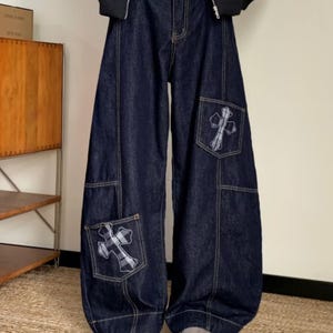 Baggy Denim Jeans | Cross Patch Wide Leg Pants | Daily Wear | Y2K Fashion Style

Baggy wide leg denim jeans with cross patch detailing and oversized Y2K fashion silhouette for casual daily outfits.