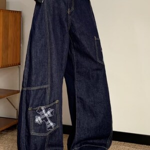 Baggy Denim Jeans | Cross Patch Wide Leg Pants | Daily Wear | Y2K Fashion Style

Baggy wide leg denim jeans with cross patch detailing and oversized Y2K fashion silhouette for casual daily outfits.