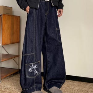 Baggy Denim Jeans | Cross Patch Wide Leg Pants | Daily Wear | Y2K Fashion Style

Baggy wide leg denim jeans with cross patch detailing and oversized Y2K fashion silhouette for casual daily outfits.