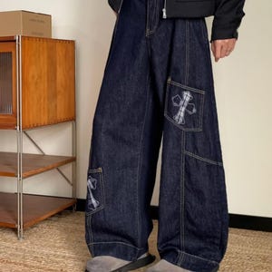 Baggy Denim Jeans | Cross Patch Wide Leg Pants | Daily Wear | Y2K Fashion Style

Baggy wide leg denim jeans with cross patch detailing and oversized Y2K fashion silhouette for casual daily outfits.