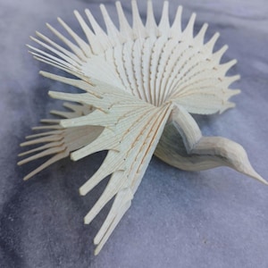 Wooden bird sculpture, fan bird, or dove of abundance, made entirely by hand from a single piece of wood