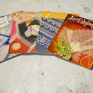 May include: Four vintage instructional booklets titled Edgings, featuring crochet patterns and lace designs. The covers display various white lace borders, floral motifs, and needlework projects in blue, red, orange, and yellow color schemes.
