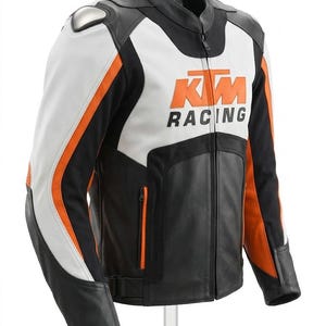 May include: A black, white, and orange motorcycle racing jacket. The jacket features the KTM Racing logo in orange on the chest. The jacket has a stand-up collar, a front zipper, and orange accents on the sleeves. The jacket has a silver shoulder protector.